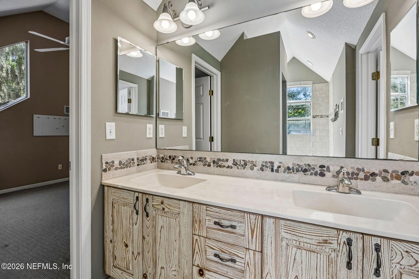 Nestled beneath a canopy of majestic live oaks and surrounded by - photo 34