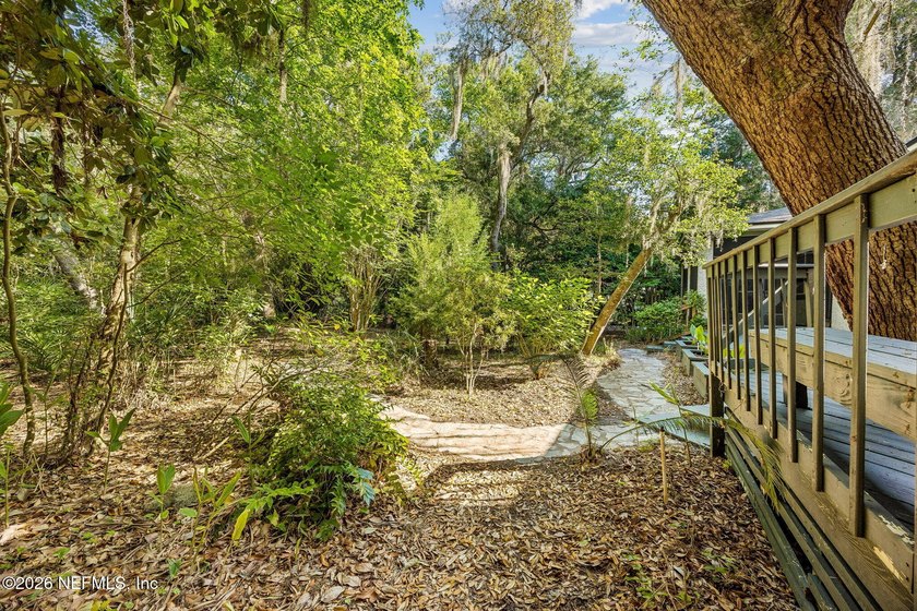 Nestled beneath a canopy of majestic live oaks and surrounded by - photo 38