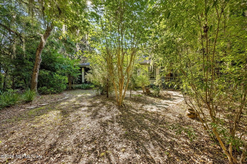 Nestled beneath a canopy of majestic live oaks and surrounded by - photo 39