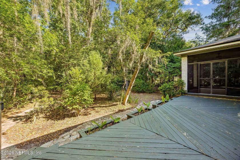 Nestled beneath a canopy of majestic live oaks and surrounded by - photo 41