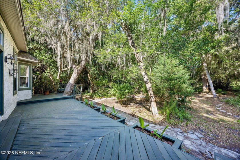Nestled beneath a canopy of majestic live oaks and surrounded by - photo 42