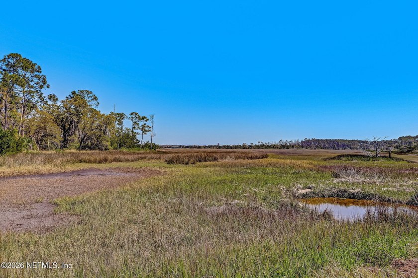 Nestled beneath a canopy of majestic live oaks and surrounded by - photo 45