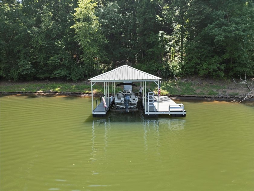 Experience exceptional lakefront living in this custom-built - photo 17