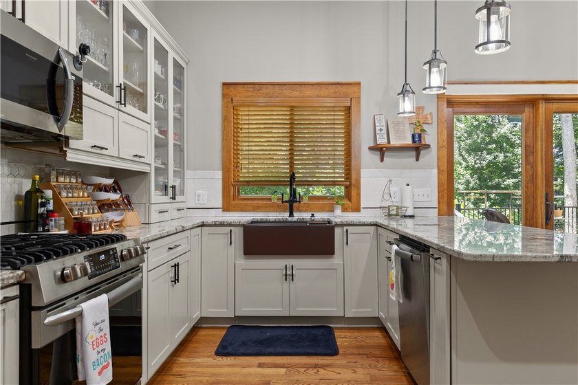 Experience exceptional lakefront living in this custom-built - photo 22