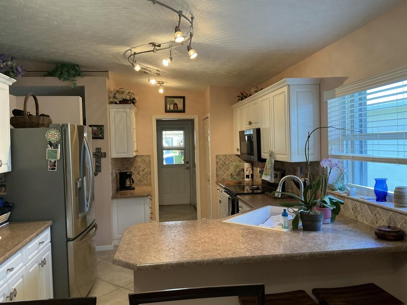 This unique Home in the Palm Grove community stand out with - photo 29