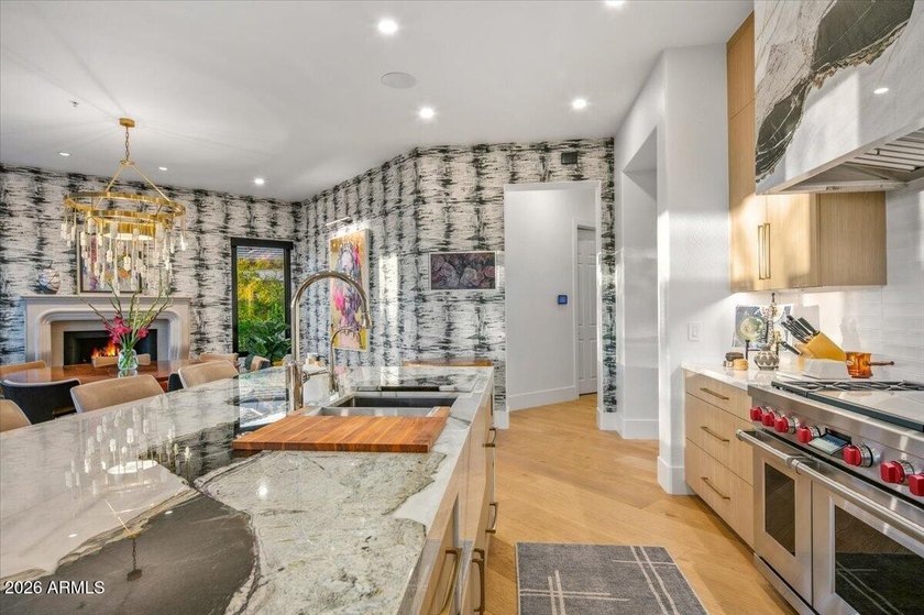 This stunning residence has been completely reimagined through - photo 9