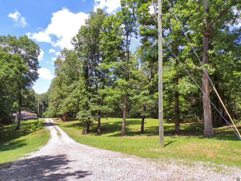 Nestled just moments from the shores of Kentucky Lake, this - photo 3