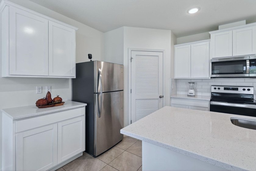 Built in 2023, this meticulously maintained 4/2 CBS home offers - photo 9