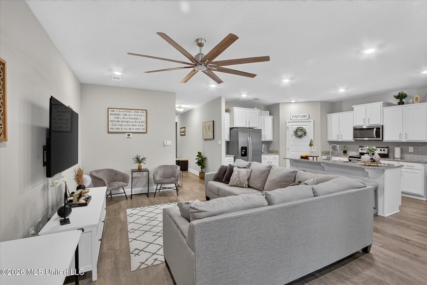 Some homes you tour. This one you settle into. The open layout - photo 11