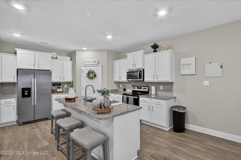 Some homes you tour. This one you settle into. The open layout - photo 13