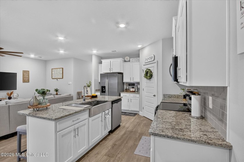 Some homes you tour. This one you settle into. The open layout - photo 14