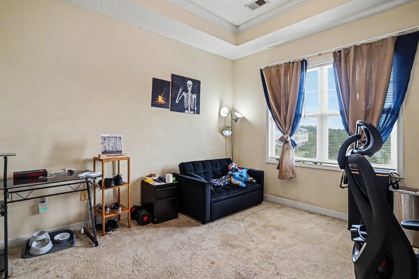 Welcome to this two-bedroom, two-bathroom top-floor condo - photo 16