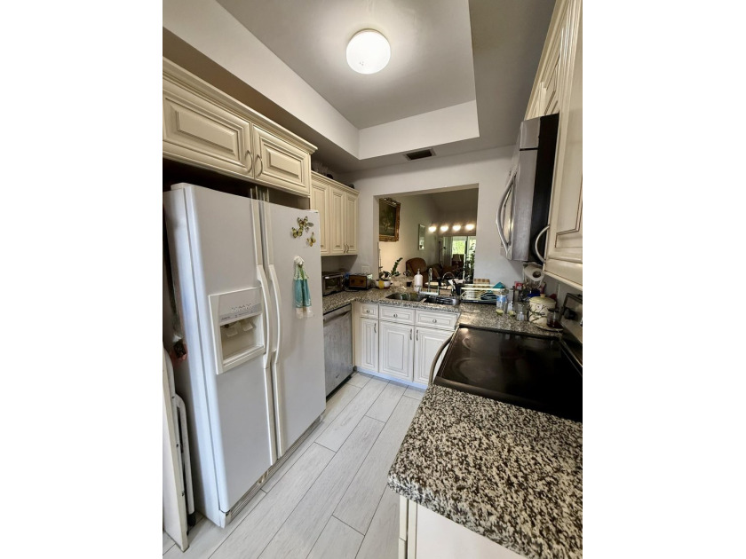 Welcome to this well-maintained 2-bedroom, 2-bath villa located - photo 8