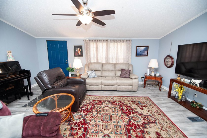 This 3 bedroom, 2 bath manufactured home is on a level .60 acre - photo 2