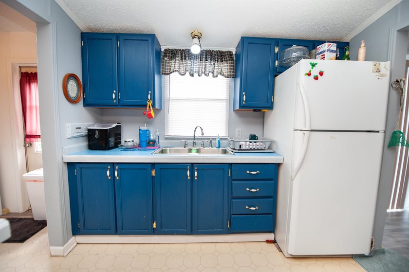 This 3 bedroom, 2 bath manufactured home is on a level .60 acre - photo 10