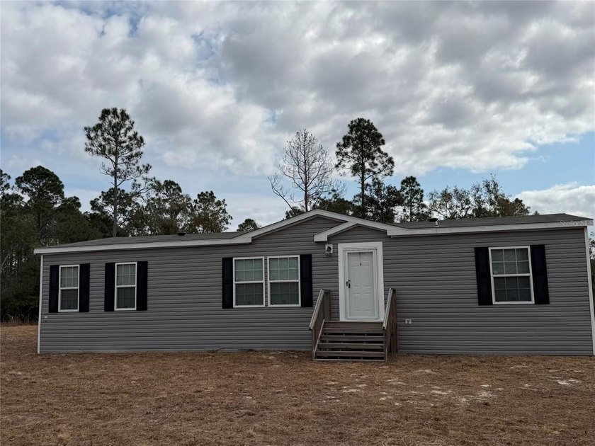Welcome to peaceful country living with modern comfort! This - photo 2