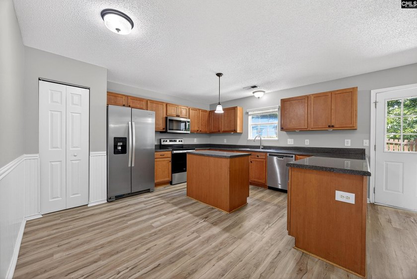 Welcome home to this beautifully updated 4-bedroom, 2.5-bath - photo 8