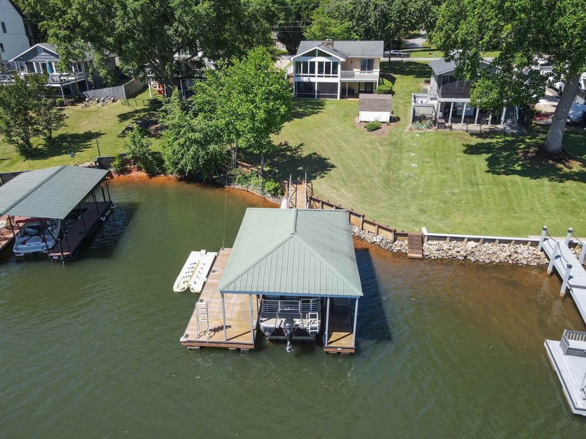 MOTIVATED SELLERS! Welcome to lakefront living at its finest on - photo 2