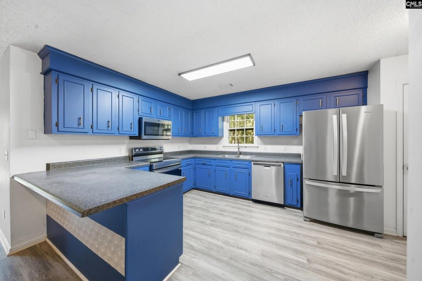 Tucked away at the end of a quiet cul-de-sac, this townhome is - photo 5