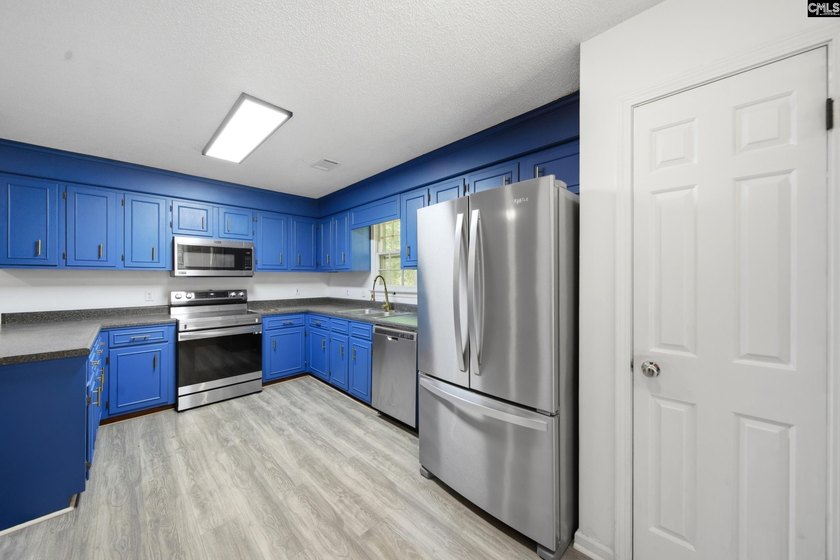 Tucked away at the end of a quiet cul-de-sac, this townhome is - photo 7