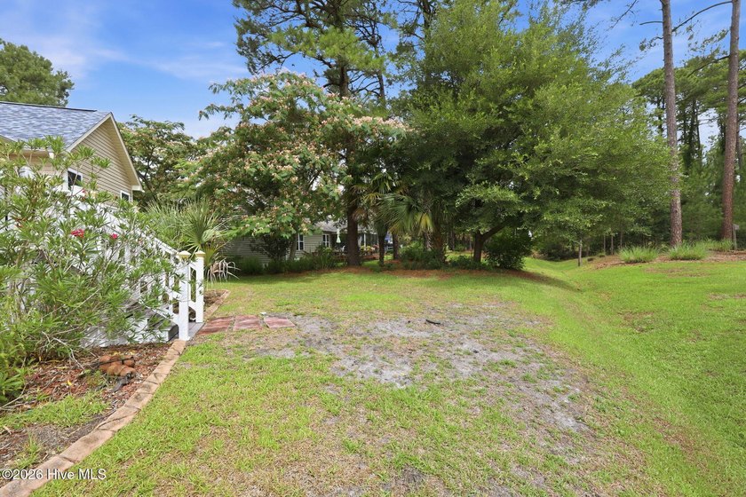 Discover refined coastal living in this beautifully maintained - photo 49