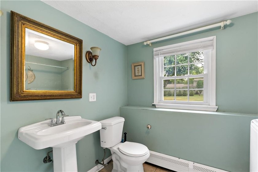 Discover the potential of this raised ranch located in the - photo 32