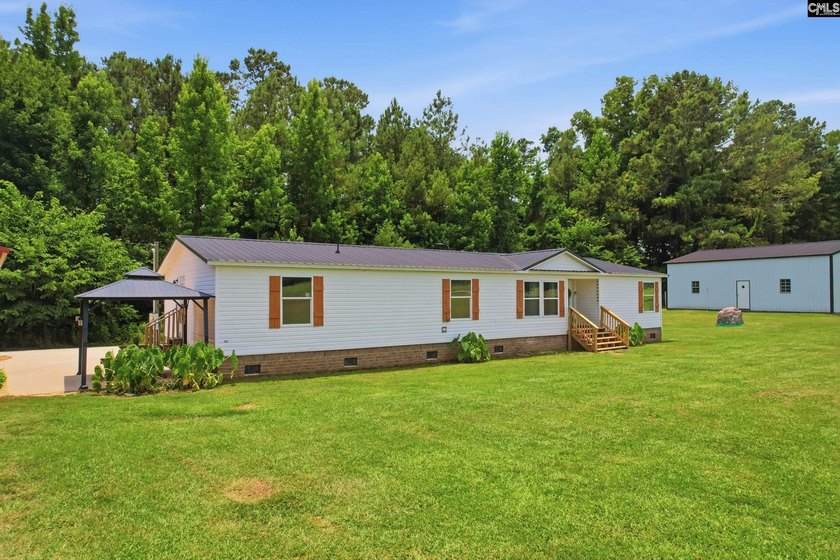 Welcome to 7580 Columbia Highway-where modern updates meet - photo 2