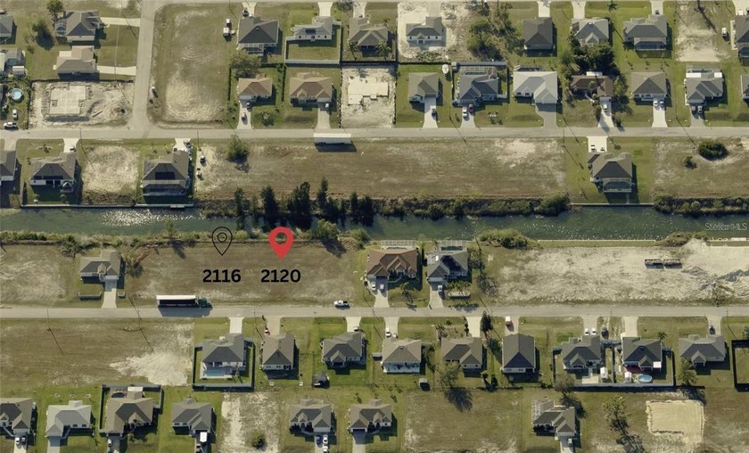 Discover 0.23-acre of pristine freshwater frontage, with one - photo 3