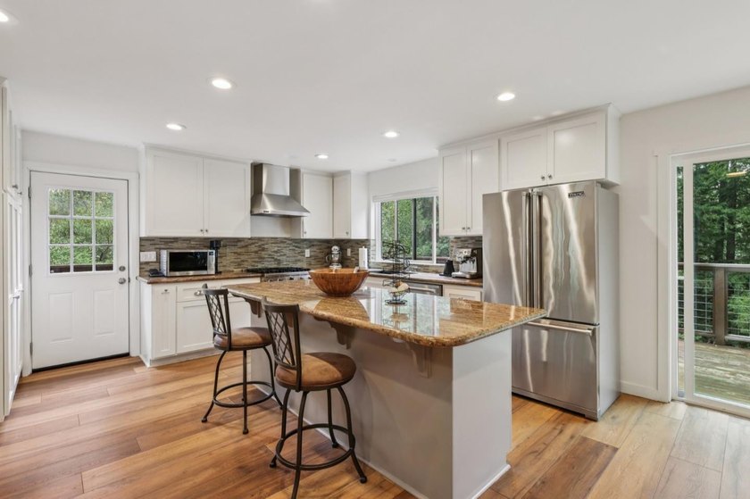 This inviting 4 bedroom, 2 and a half bathroom home, fully - photo 2