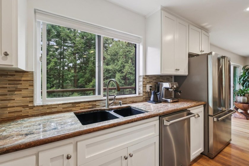 This inviting 4 bedroom, 2 and a half bathroom home, fully - photo 9
