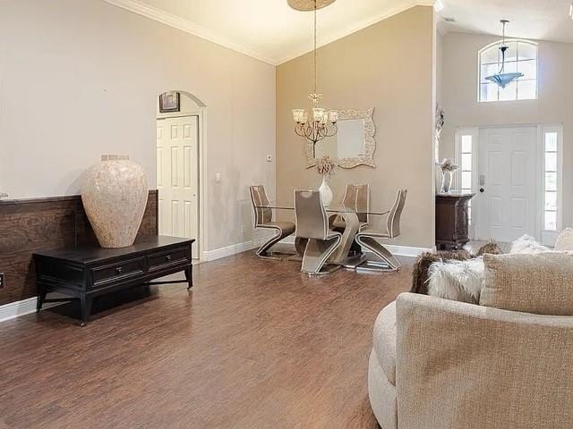 Step inside to a bright, 4BR 2 BA home enhanced by warm wood - photo 5