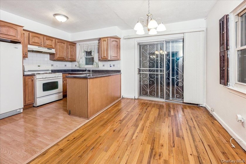 Welcome to 2125 Homer Avenue, a well maintained two-family brick - photo 6