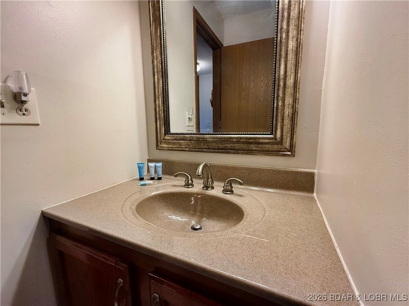 Enjoy lake living at its best in this beautifully maintained - photo 25