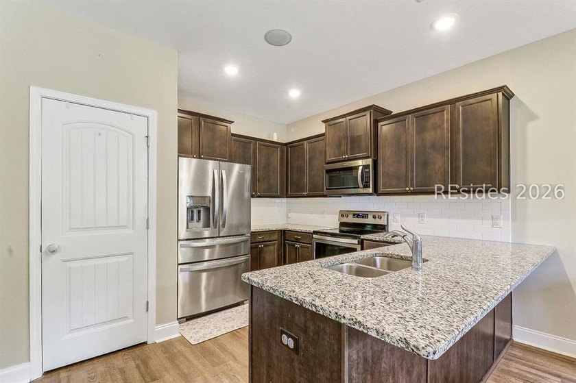 Enjoy this single level, 3BR/2BA open floor plan home on almost - photo 12