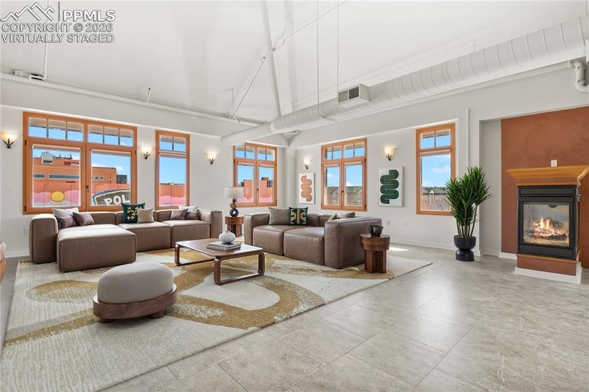 This rare penthouse corner residence in Poet Lofts, offers an - photo 4