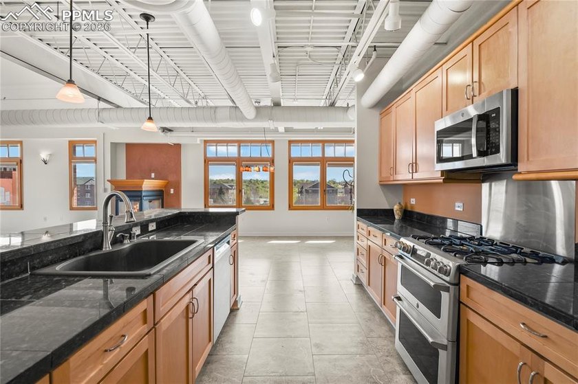 This rare penthouse corner residence in Poet Lofts, offers an - photo 7