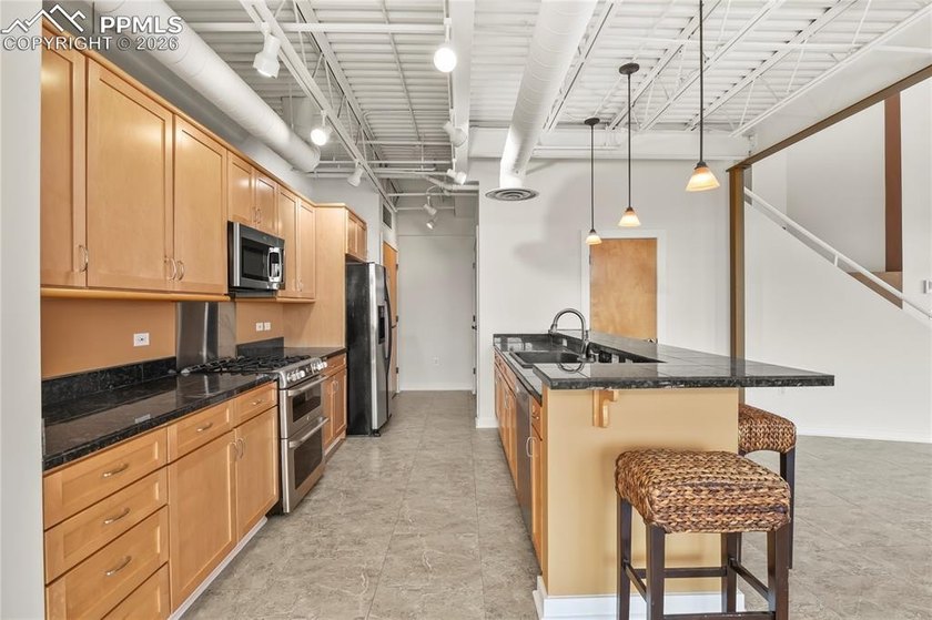 This rare penthouse corner residence in Poet Lofts, offers an - photo 9