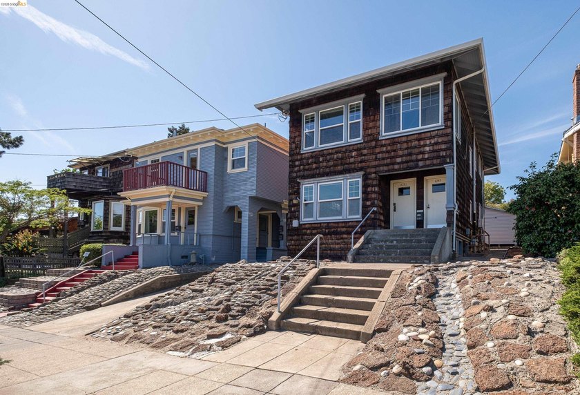 This beautifully preserved 1910 duplex blends timeless character - photo 2