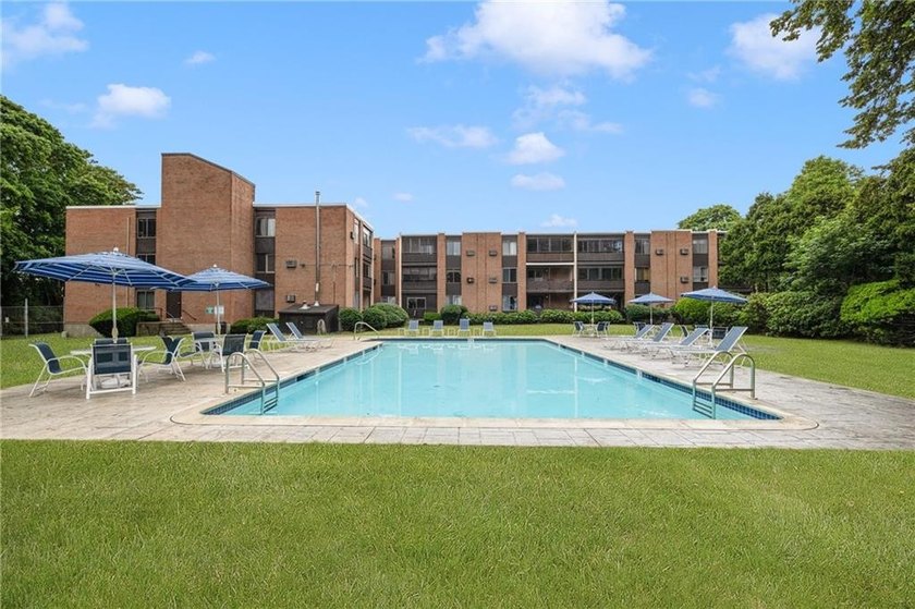Overlooking the lush greenery and in-ground pool, this private - photo 25