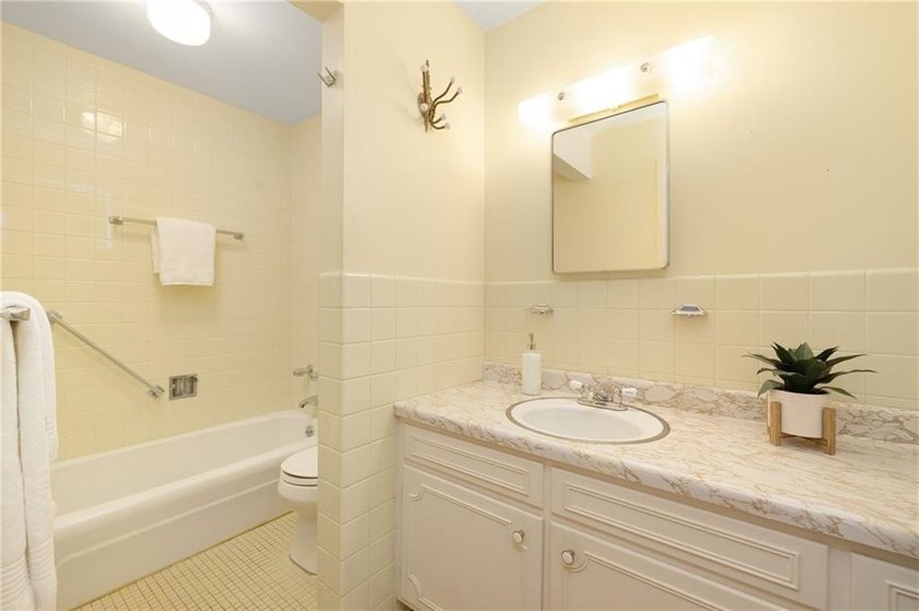 Overlooking the lush greenery and in-ground pool, this private - photo 38
