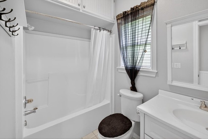 Located on a spacious corner lot, this waterfront 3-bedroom - photo 21
