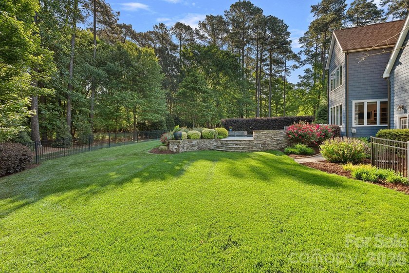 Set on a beautifully landscaped corner lot in a highly - photo 45