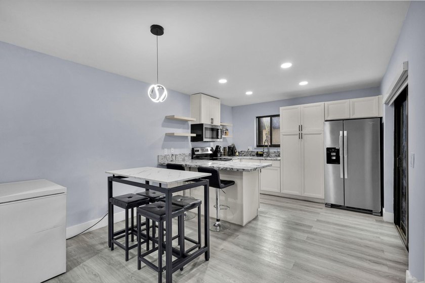 Welcome to this beautifully remodeled 2 bedroom, 1.5 bathroom - photo 2