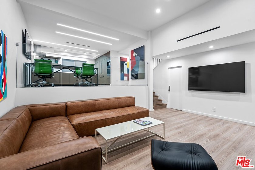 This extensively renovated front-facing multi-story townhome - photo 3