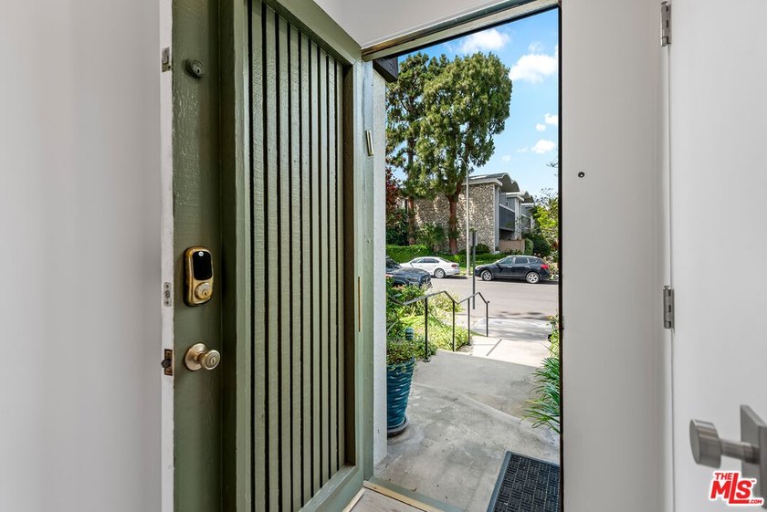 This extensively renovated front-facing multi-story townhome - photo 8