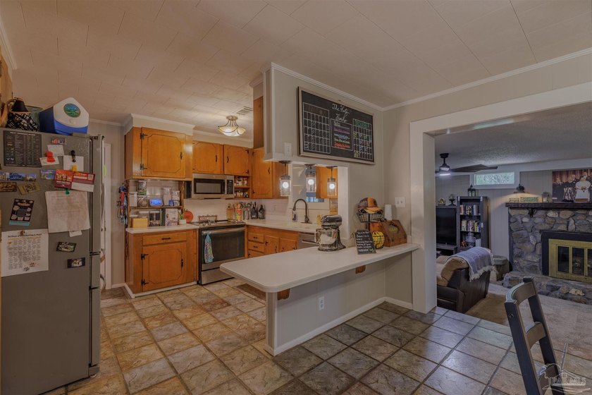 Welcome home to 902 N 75th Avenue, a charming property that - photo 11