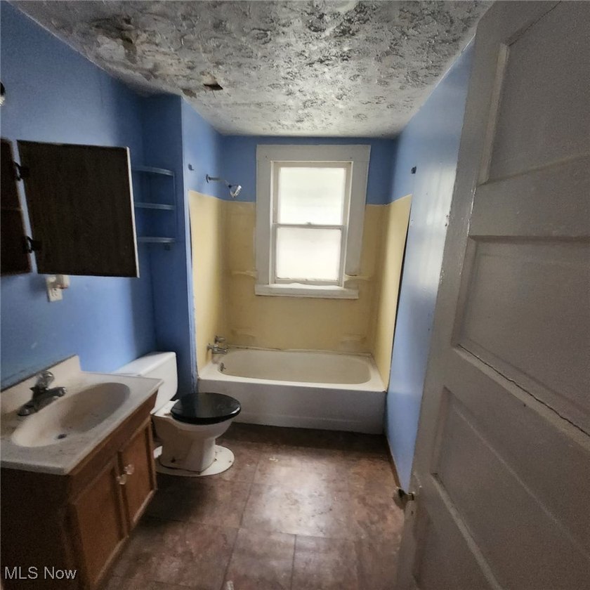 Opportunity awaits with this duplex featuring an upper unit that - photo 16