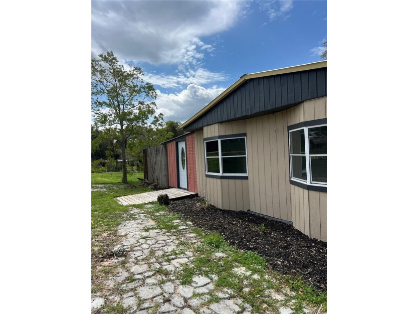 Owner financing available! This charming 3-bedroom, 2-bath home - photo 2