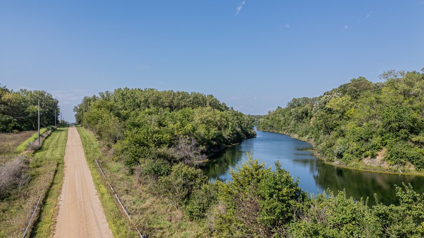 Behold this stunning spring-fed lake on over 60 acres of lush - photo 6