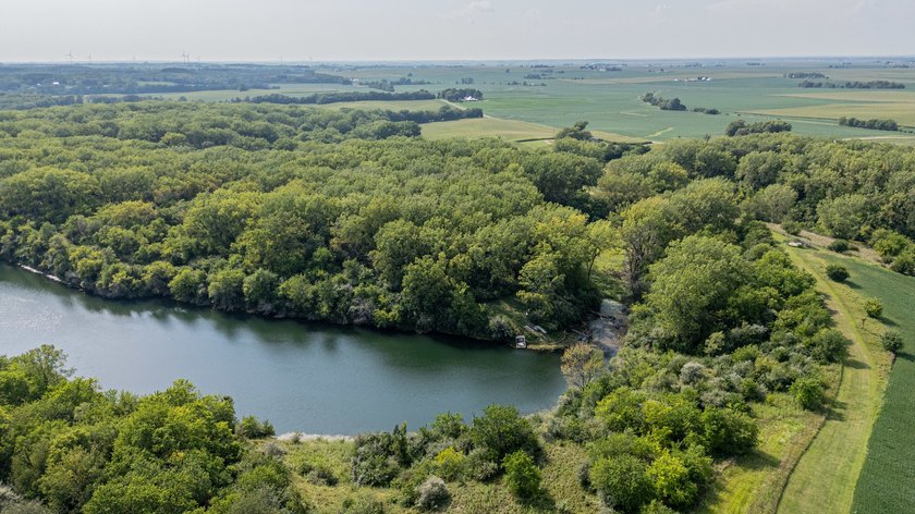 Behold this stunning spring-fed lake on over 60 acres of lush - photo 7